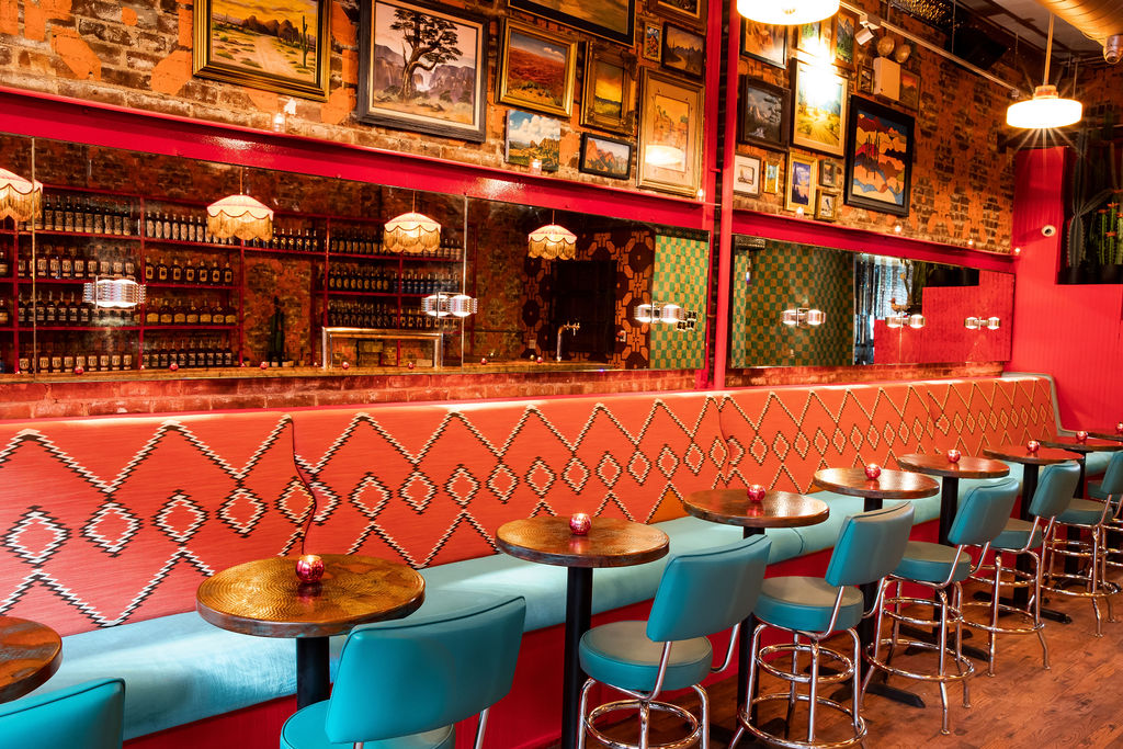 a restaurant with tables and chairs