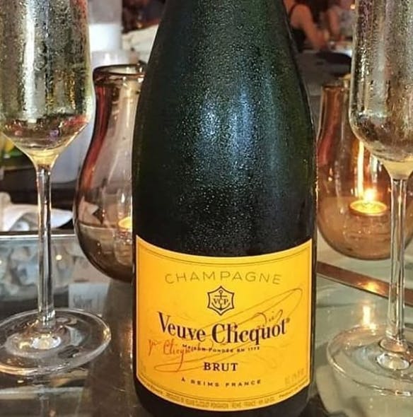 a bottle and a glass of wine