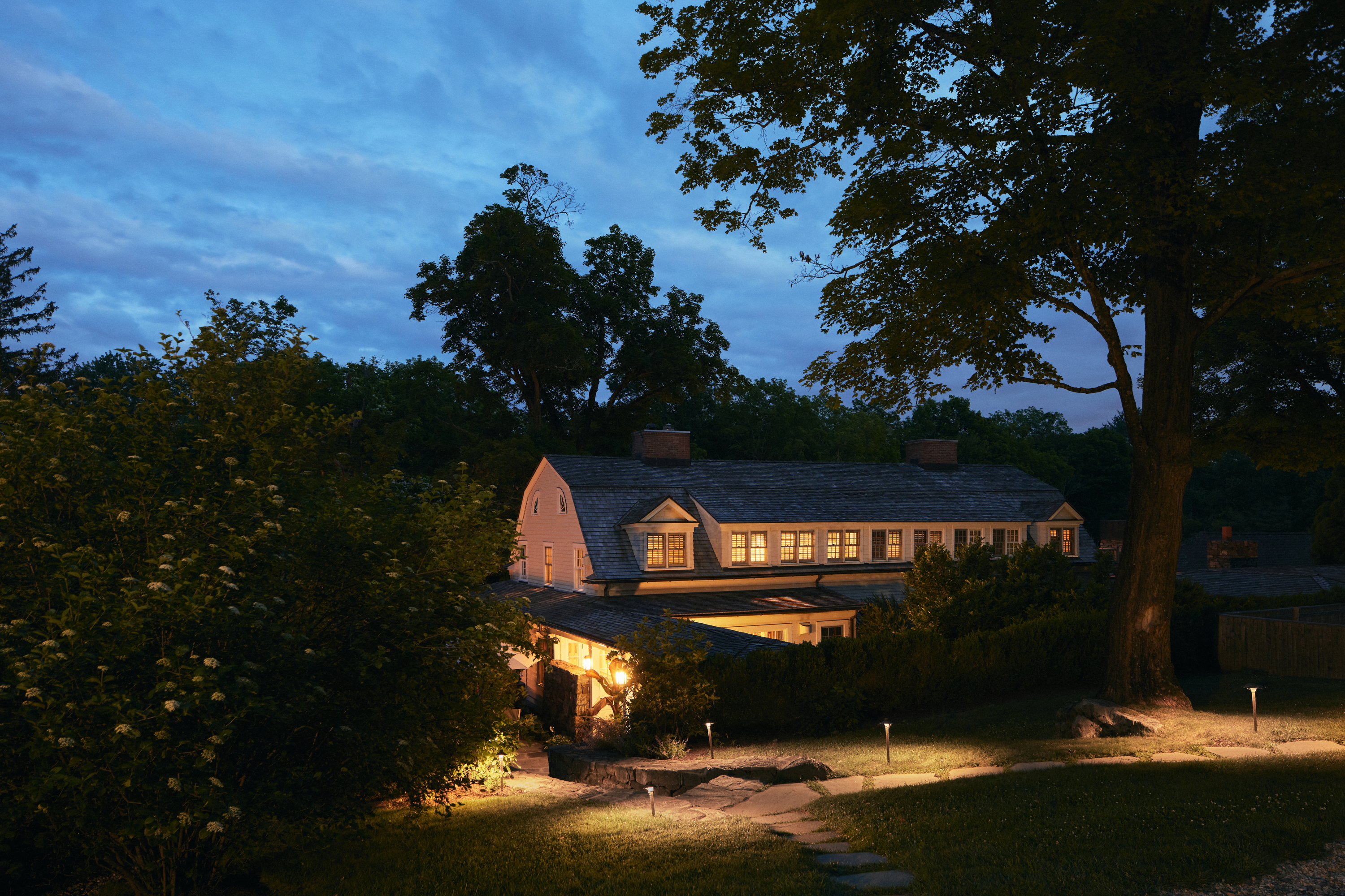 a house with trees in the background