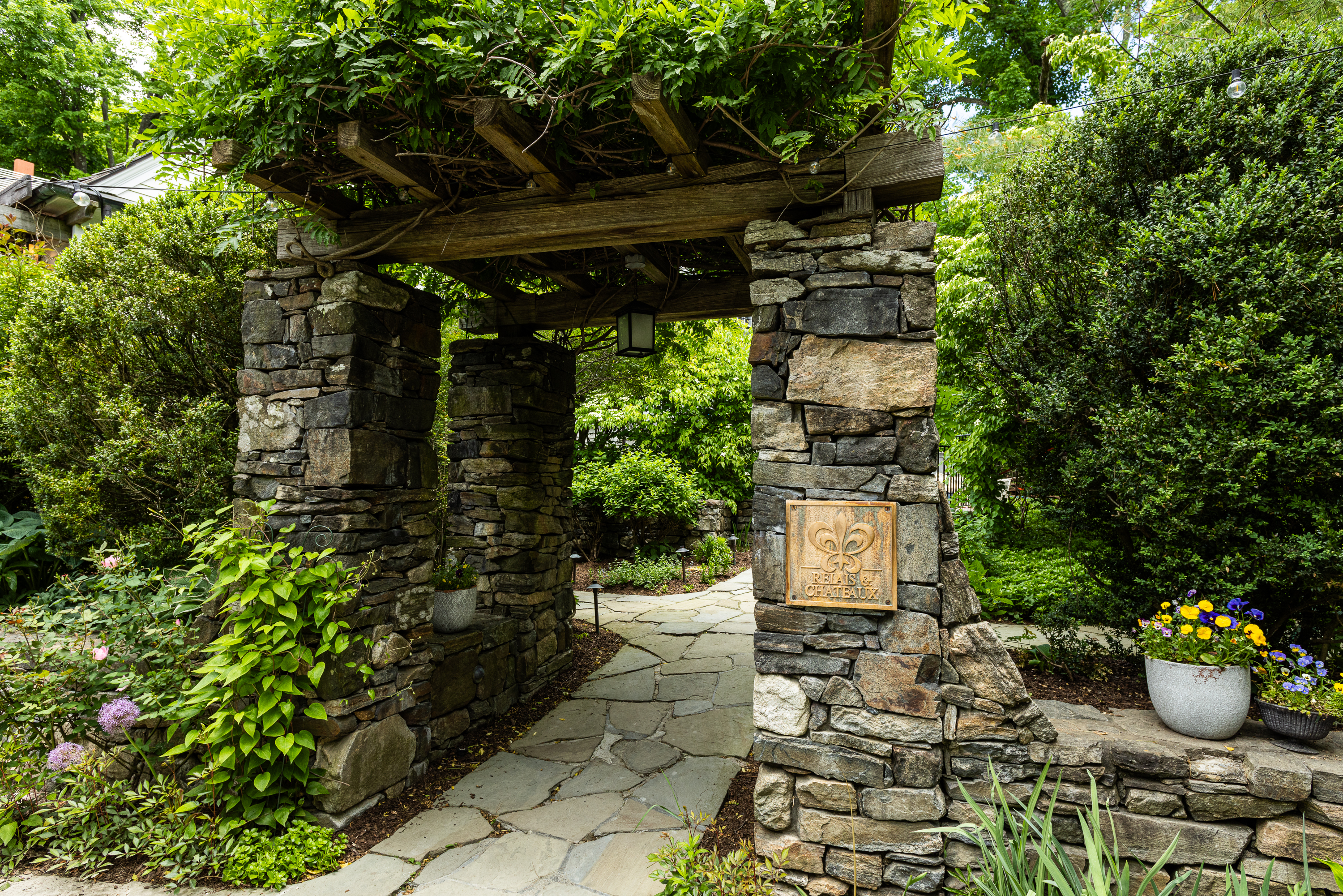 a stone bench in a garden