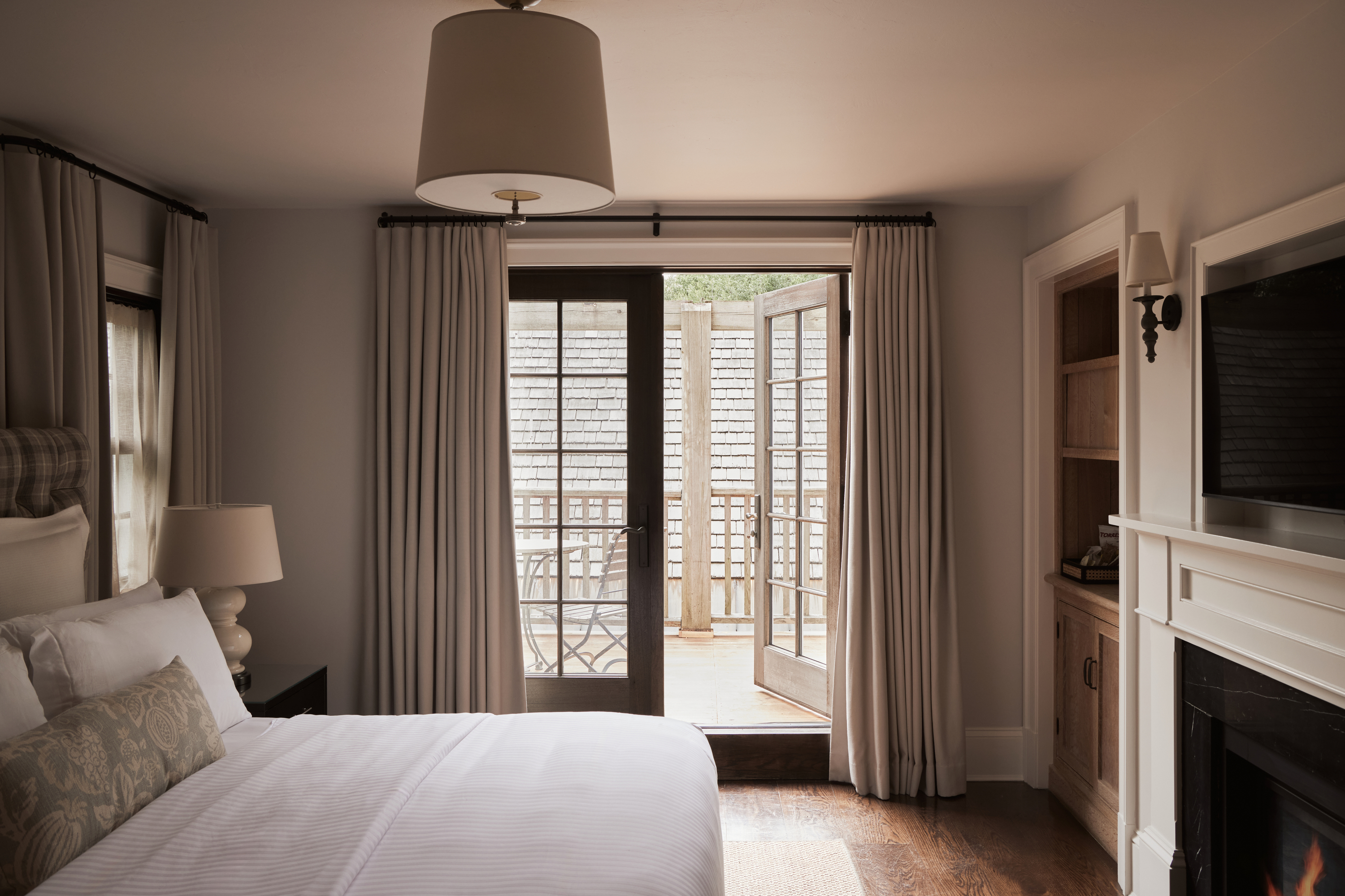 a bedroom with a large bed in a hotel room