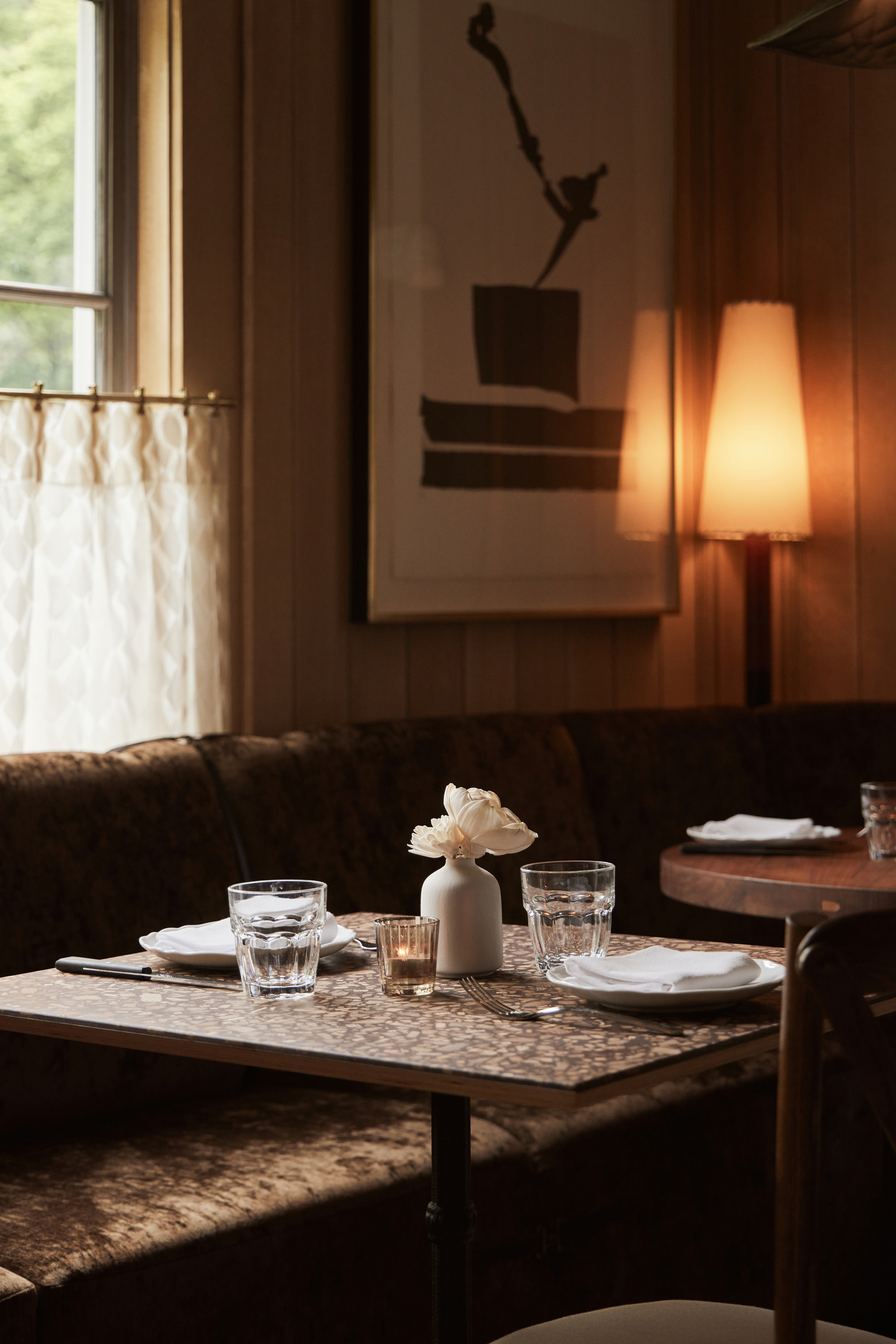 a hotel room with a sink and a mirror