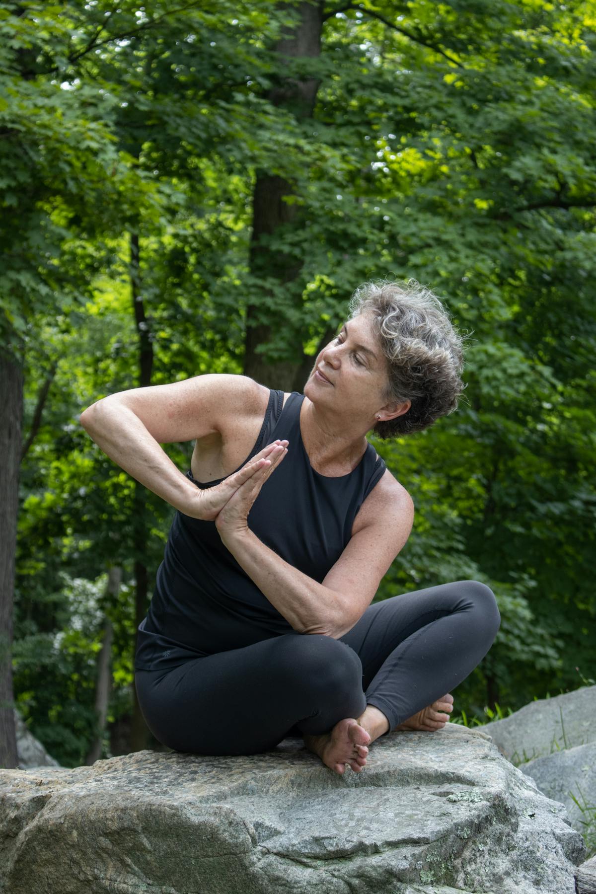 a man sitting on a rock