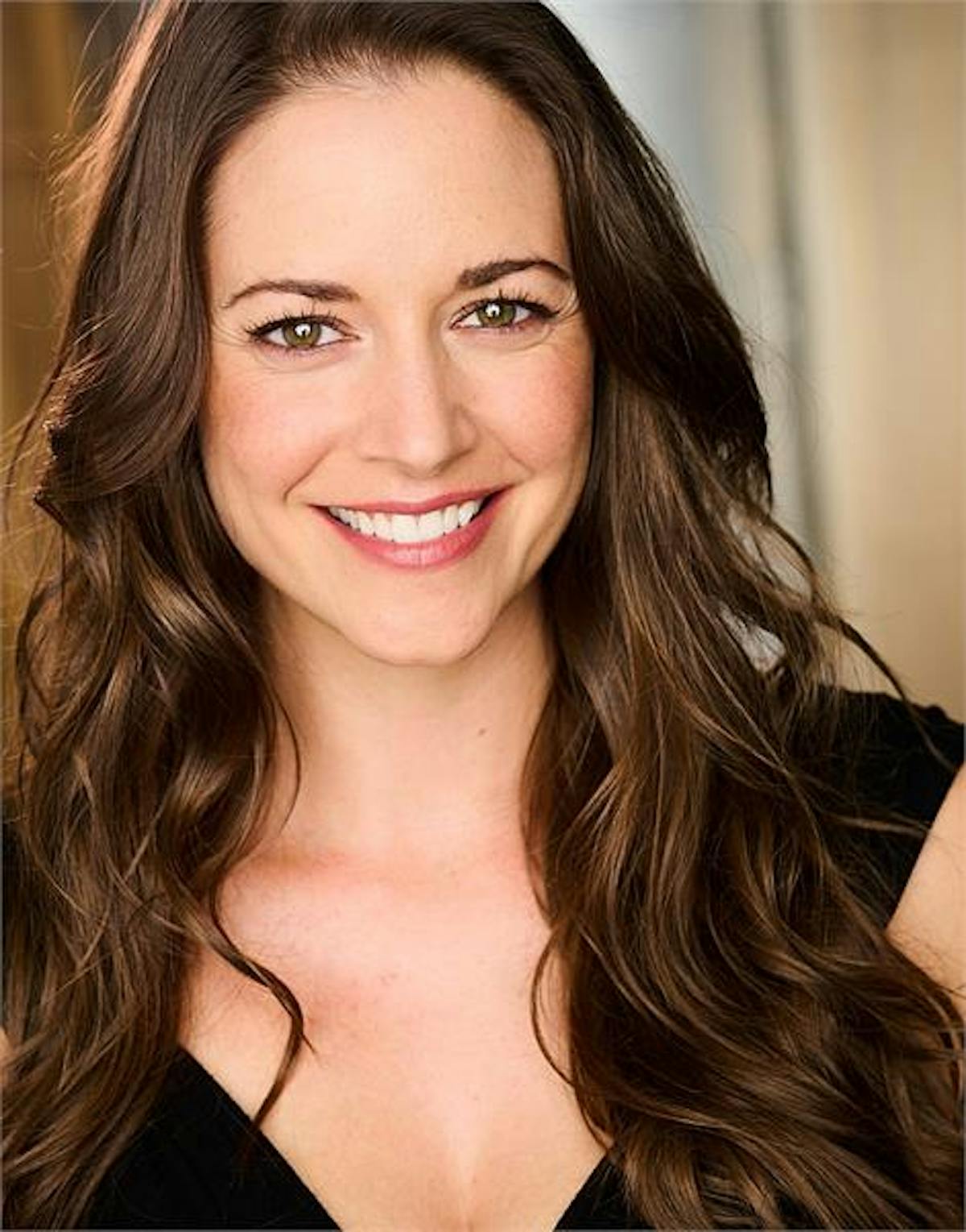 a woman smiling for the camera