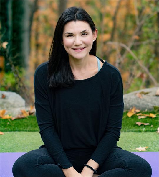 a woman sitting on a bench
