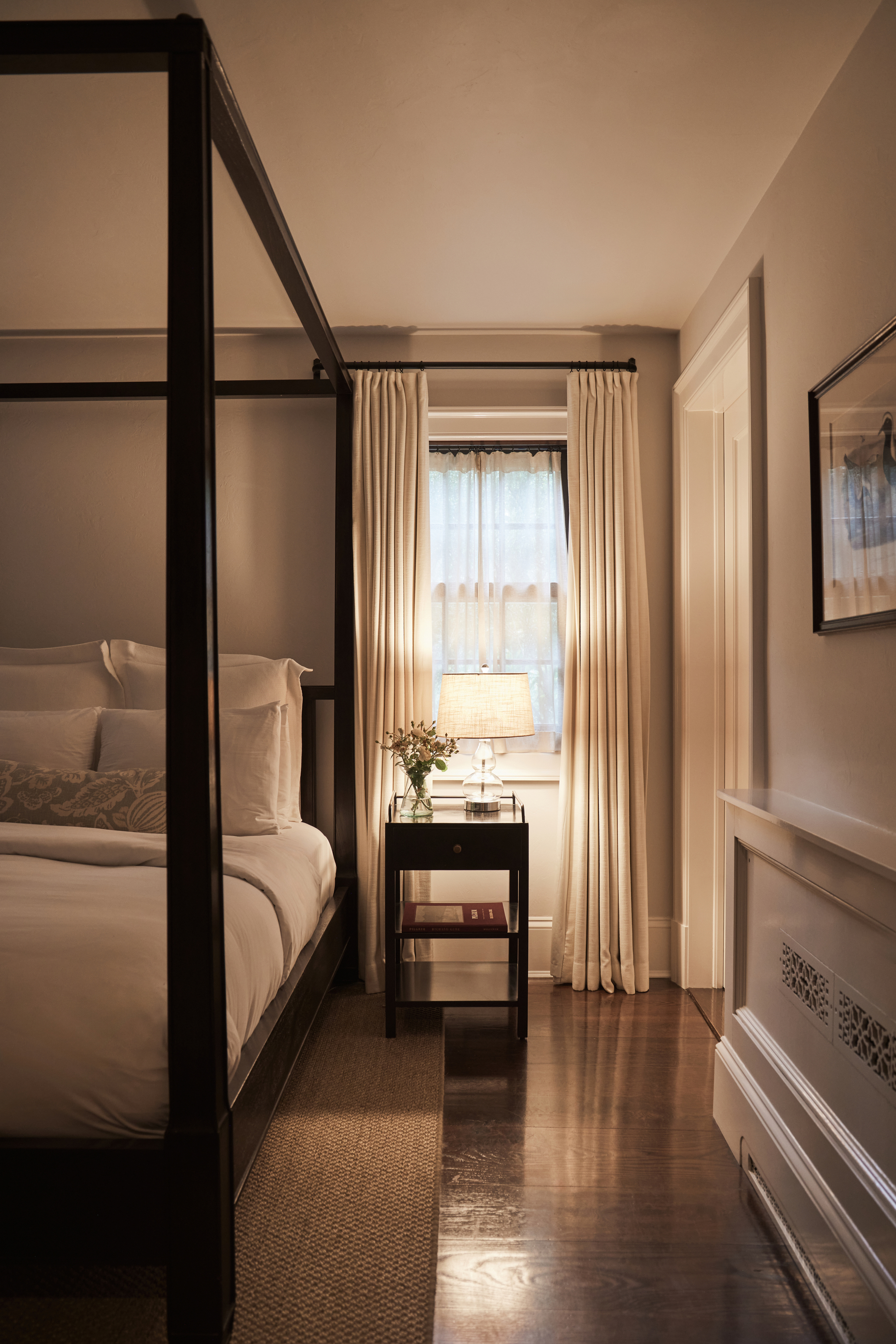 a bedroom with a large window