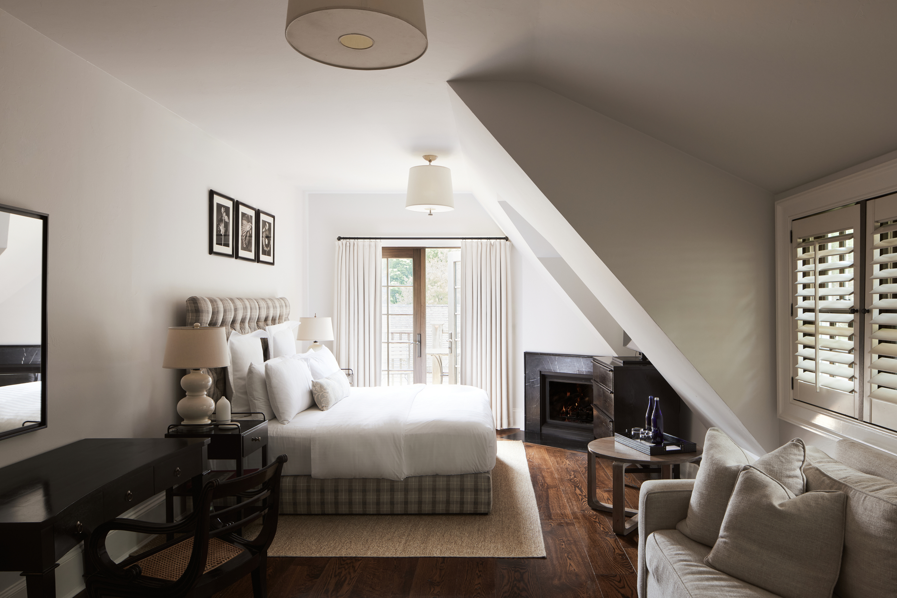 a living room filled with furniture and a large window