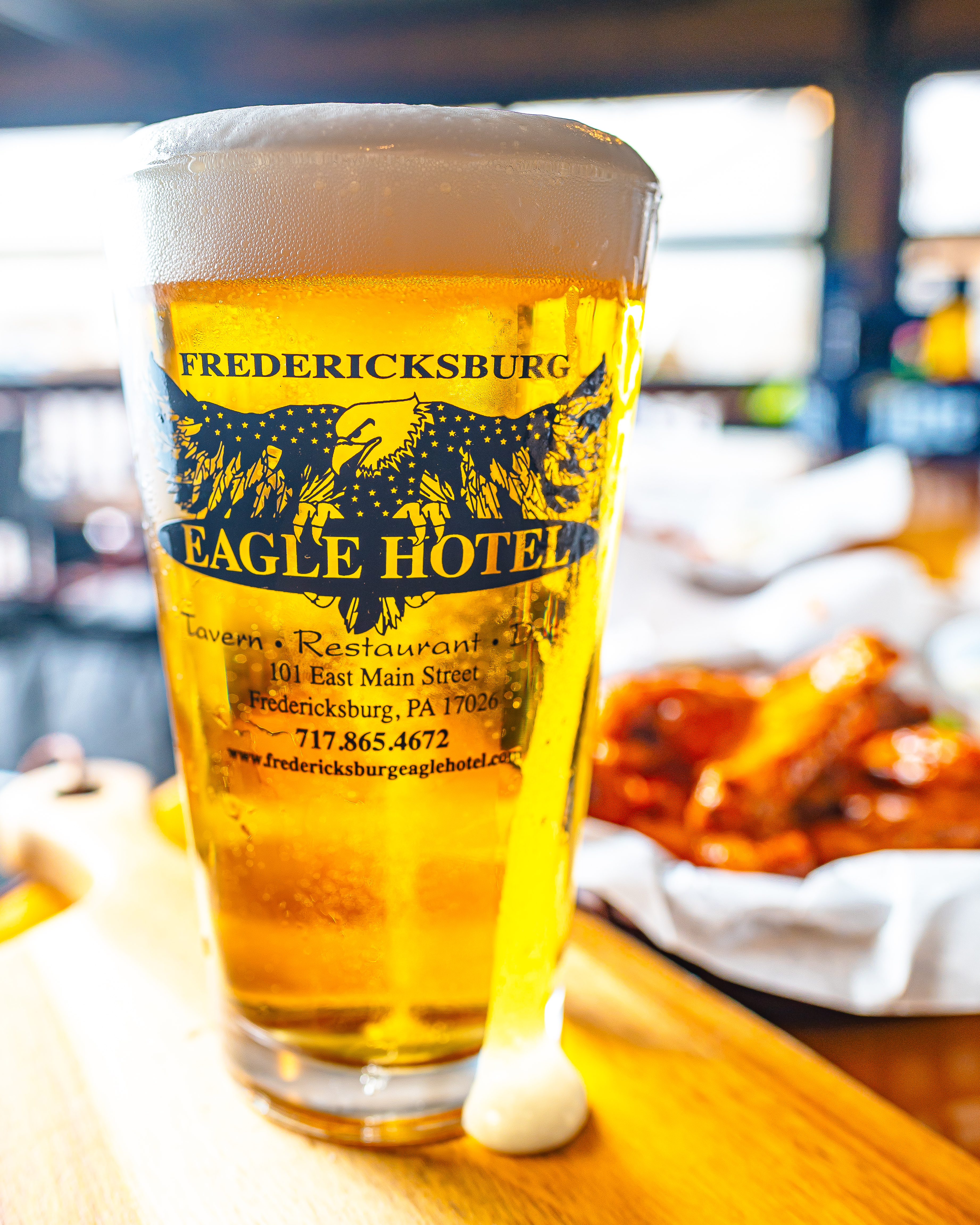 a glass of beer on a table