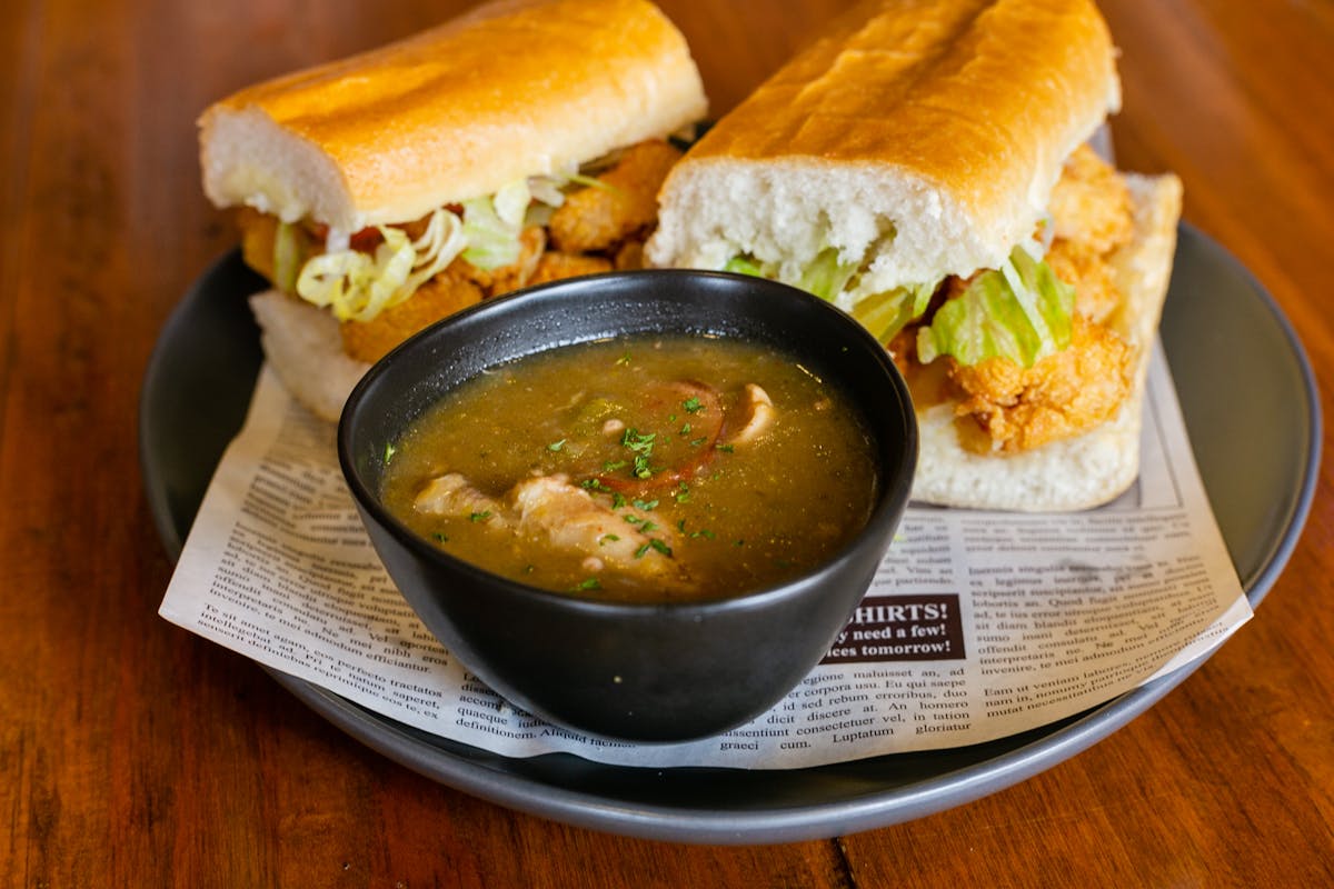 a bowl of food sitting on top of a wooden table