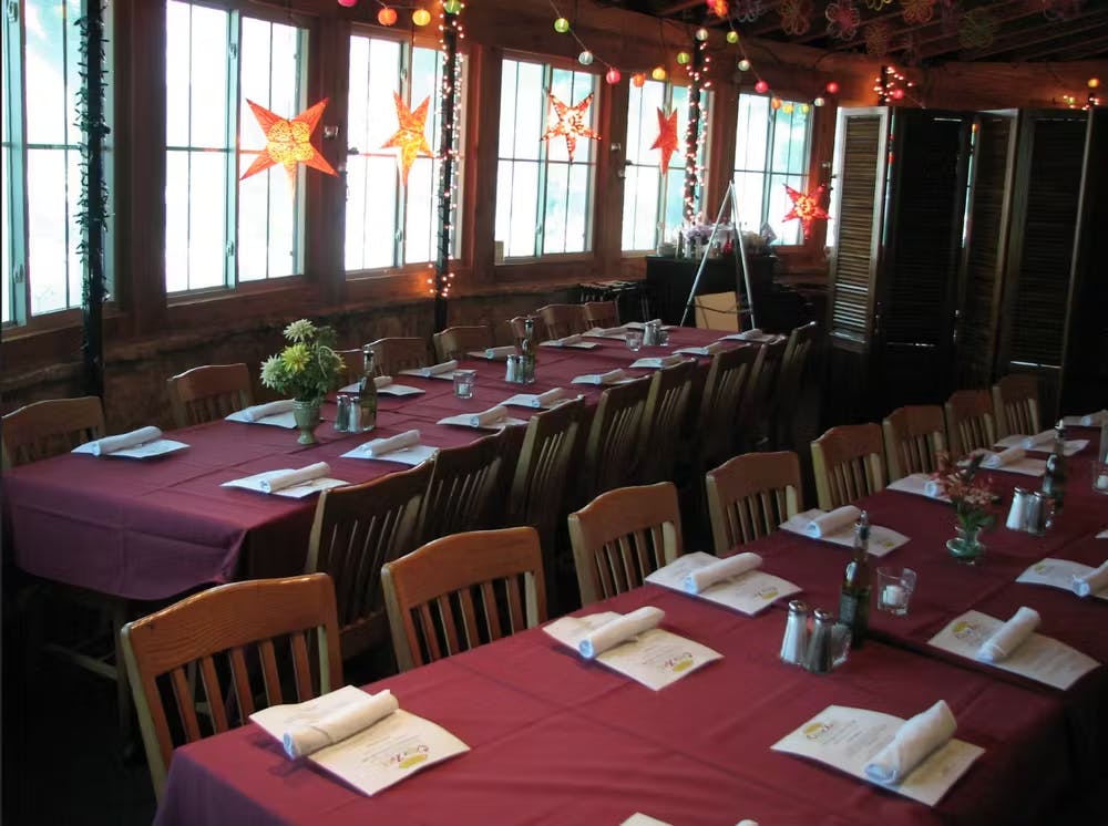 a dining room table in front of a window