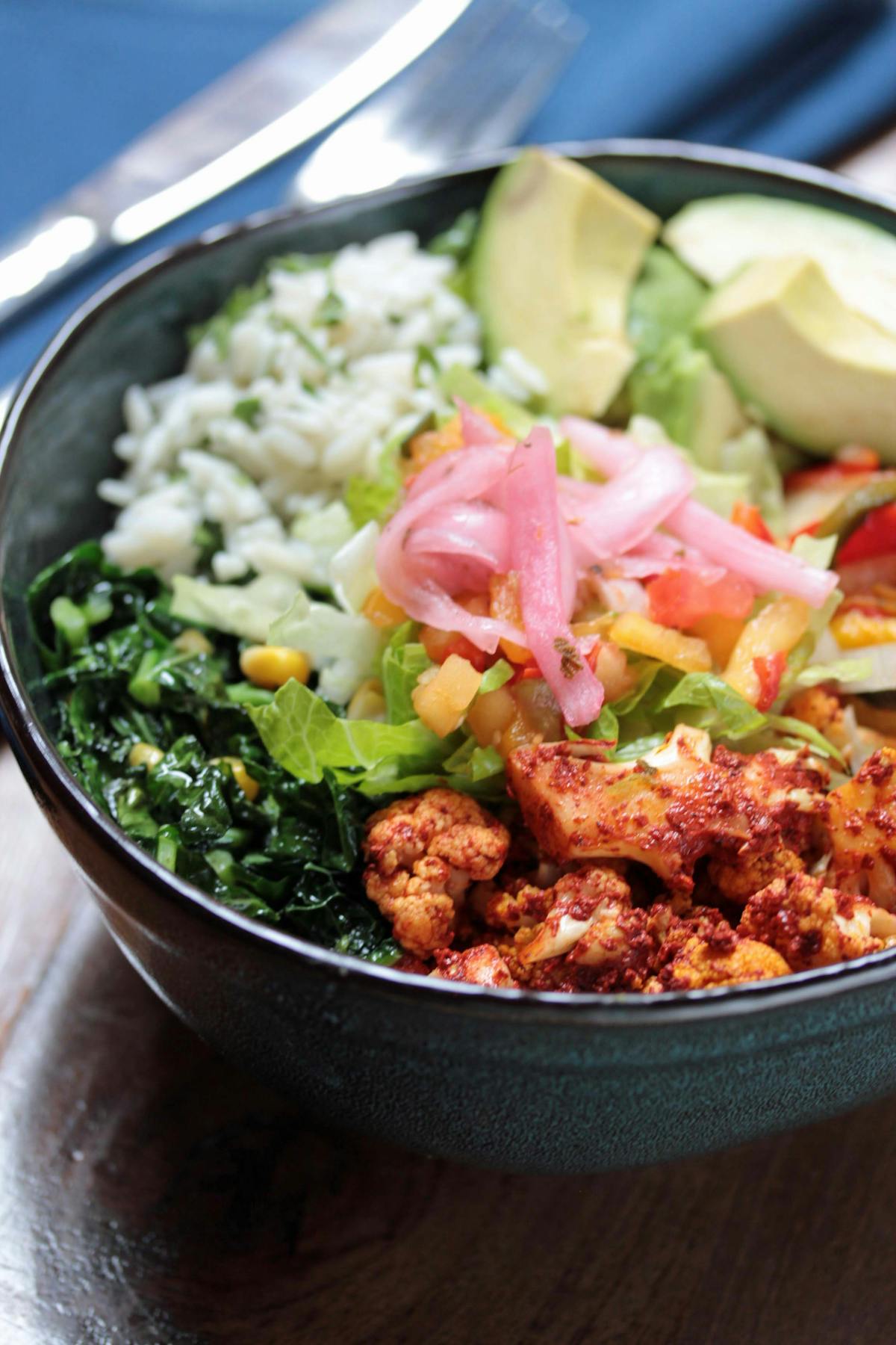 a bowl of food with broccoli