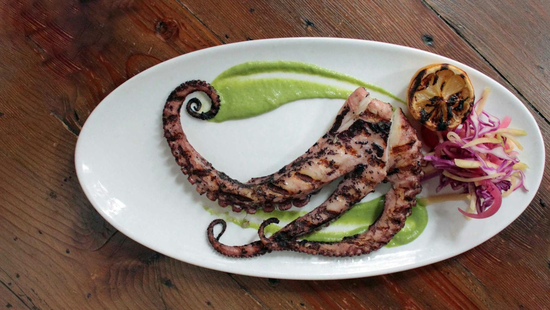 a plate of food on a wooden table