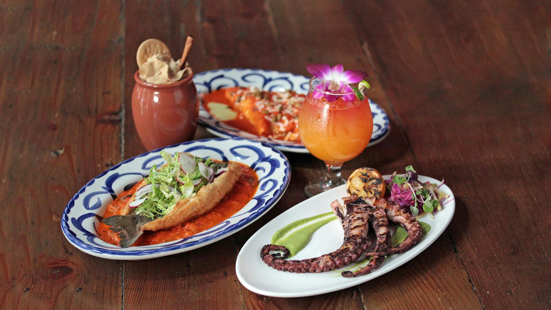 a plate of food sitting on top of a wooden table