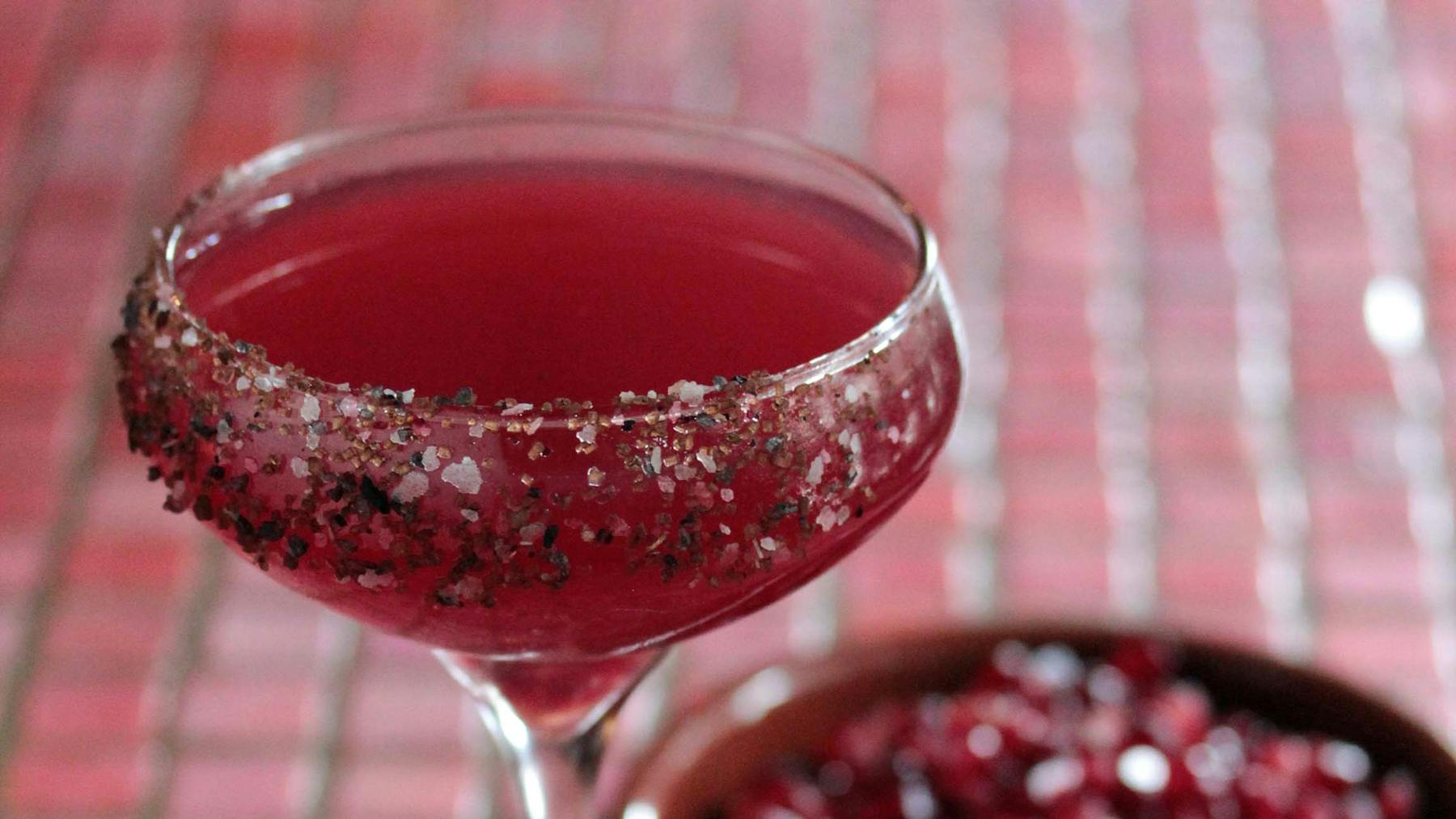 a close up of a red cup sitting on a table