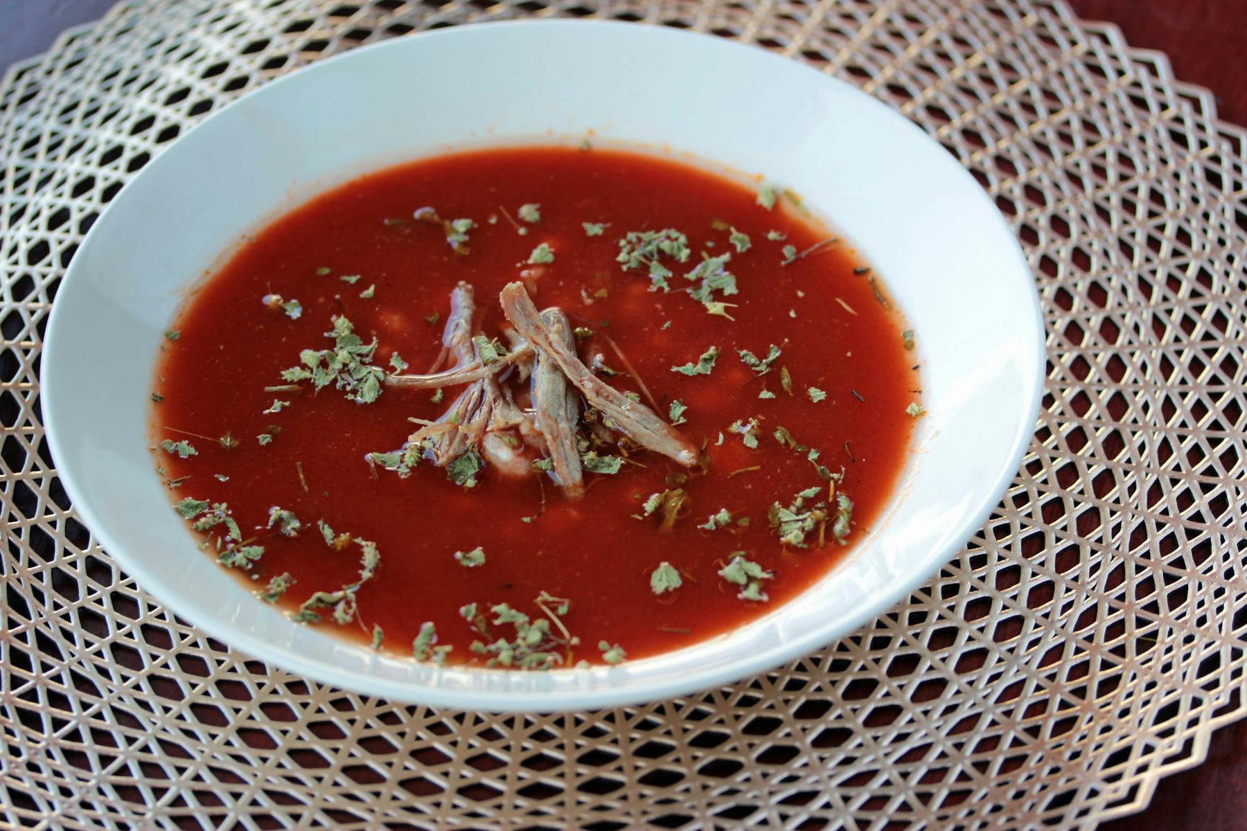 a bowl of soup sitting on a plate