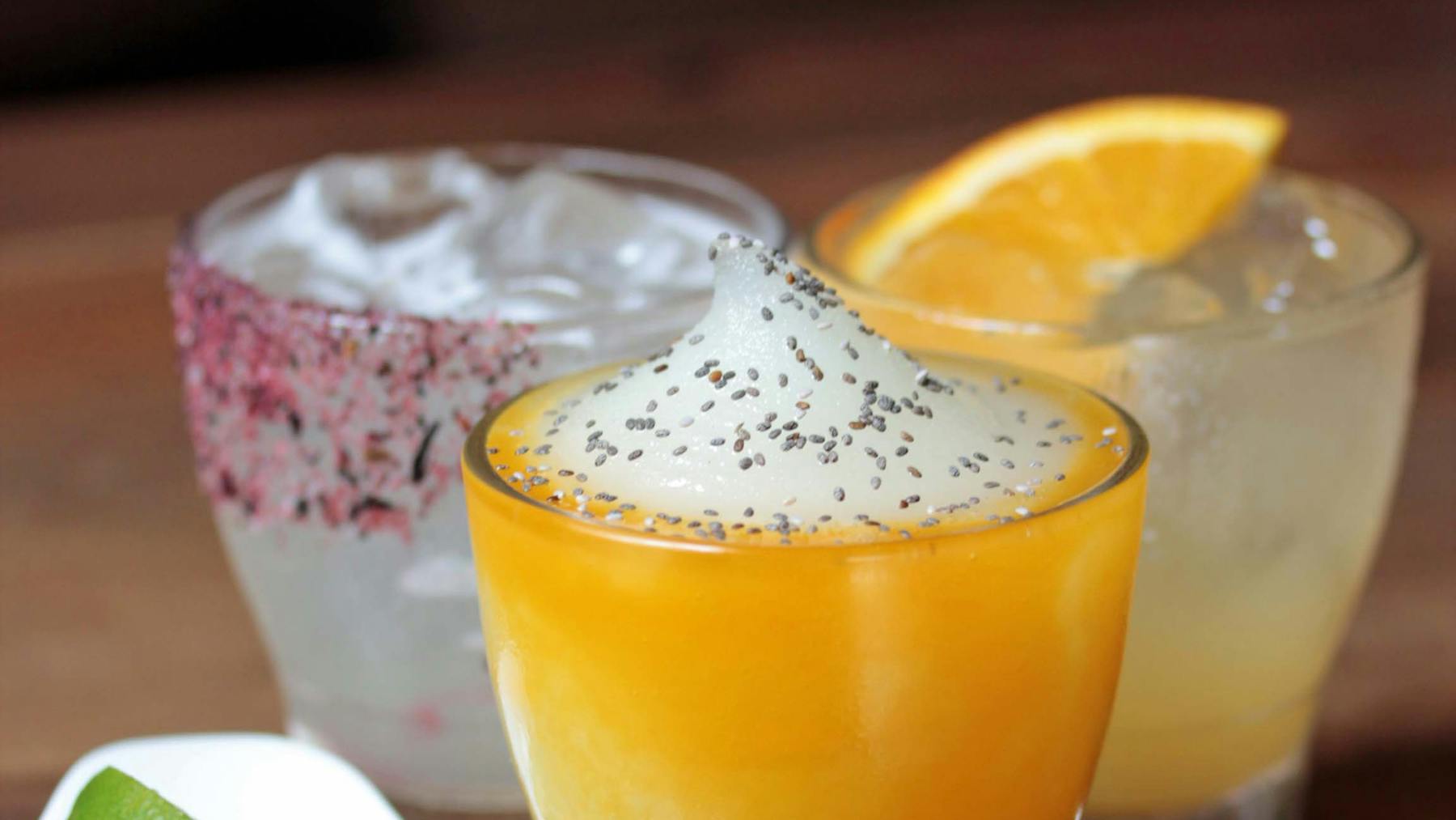 a close up of a glass of orange juice