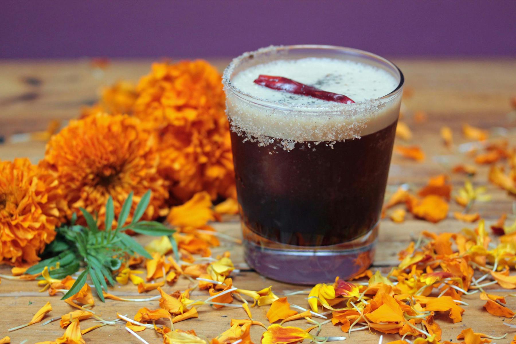 a glass of beer on a table