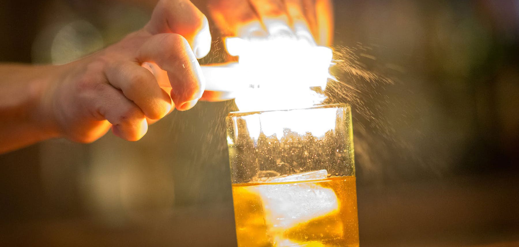A man preparing a cocktail