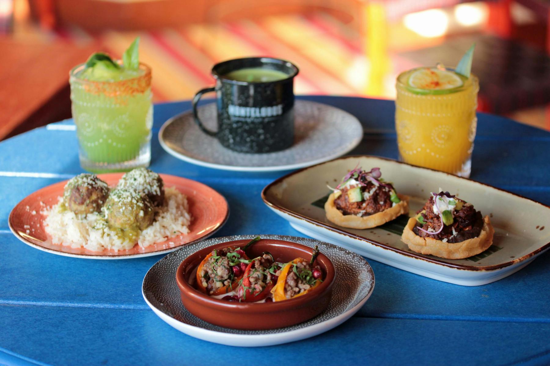 multiple plates of food on a table