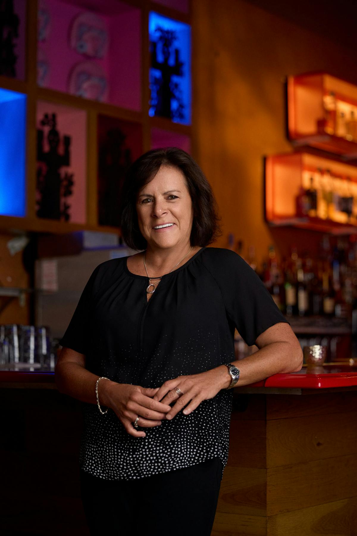 a woman standing in front of a restaurant