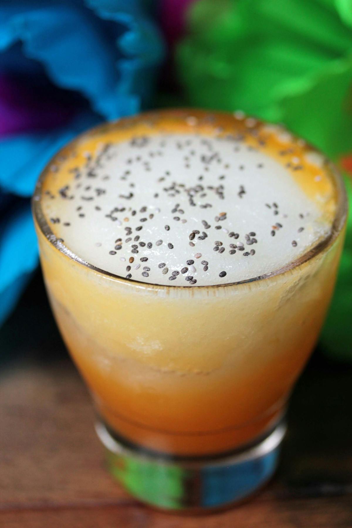 a close up of a glass of orange juice