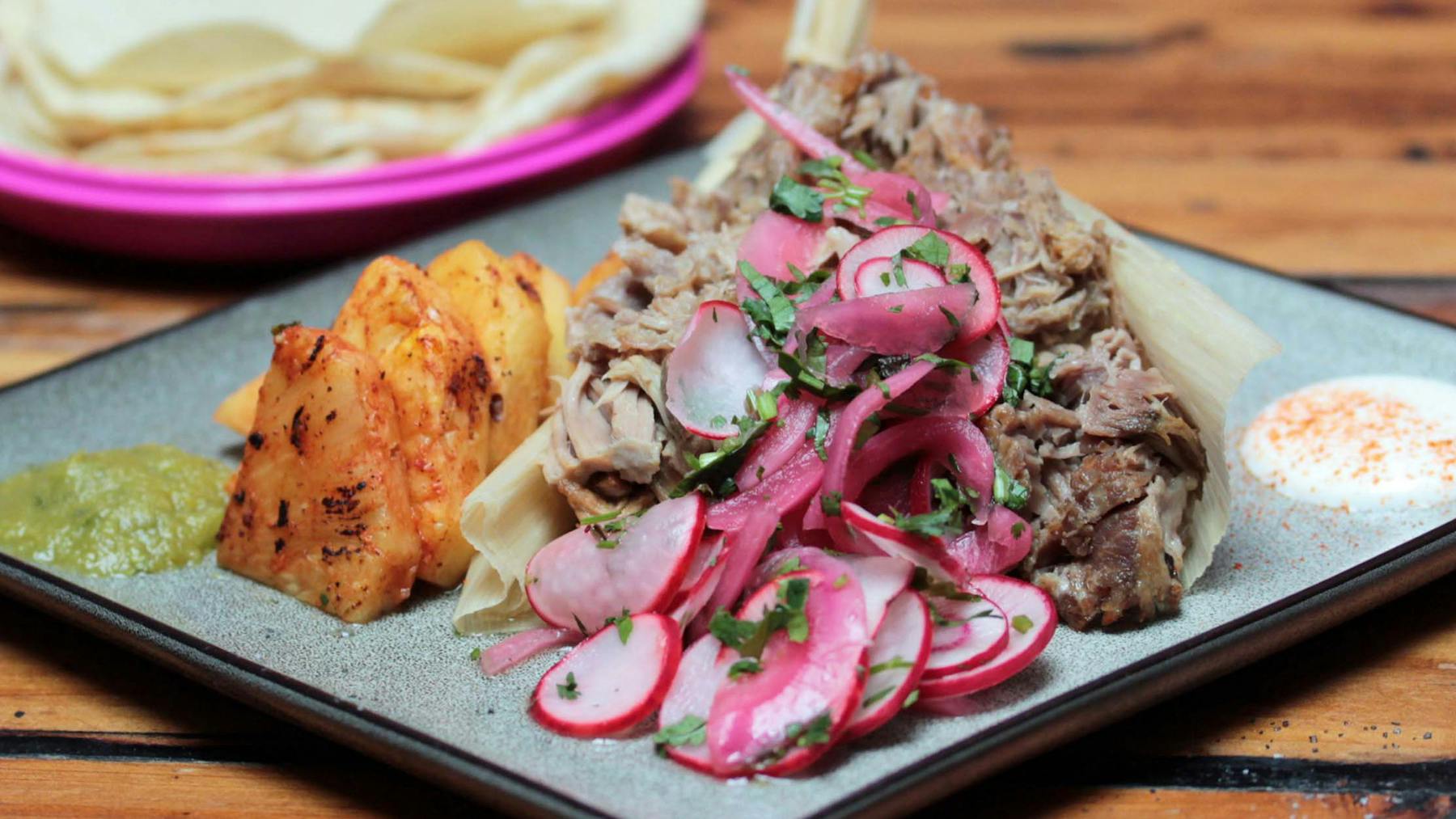 a plate of food on a wooden table