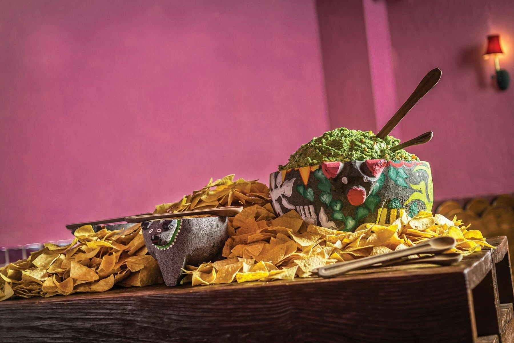 a person sitting at a table full of food