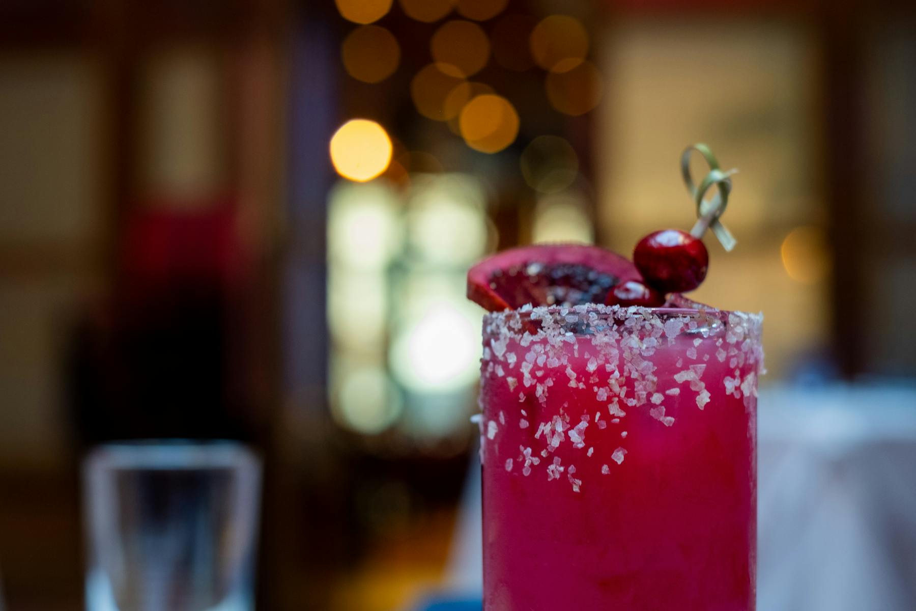 a red apple sitting on top of a table