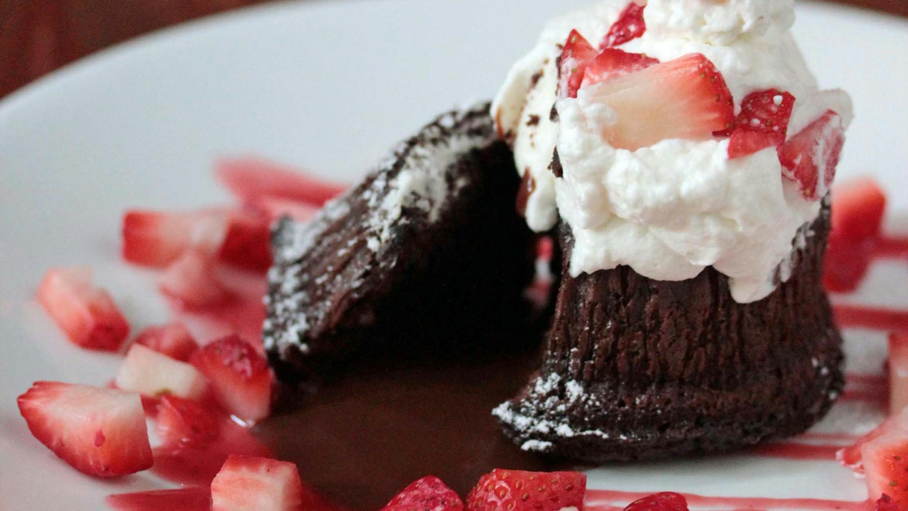a close up of a slice of cake and ice cream on a plate