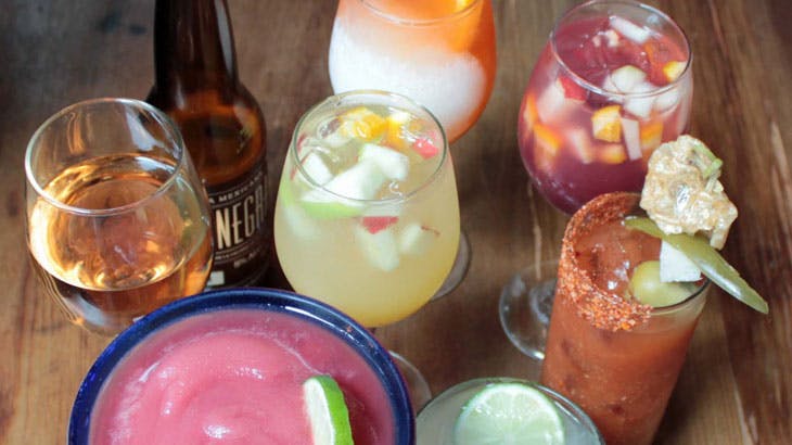 mixed drinks on a wood table