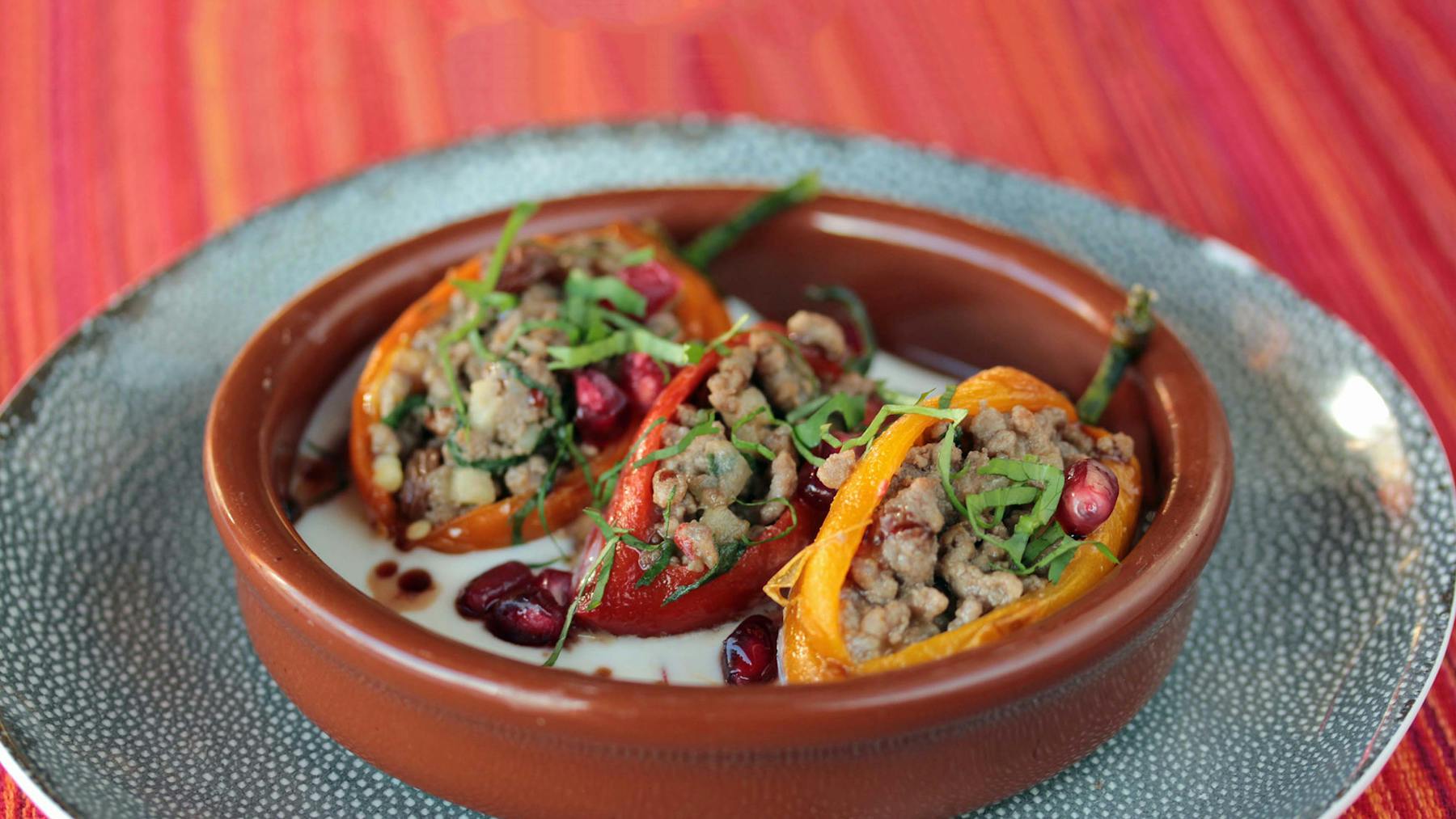 a bowl of stuffed sweet peppers on a plate