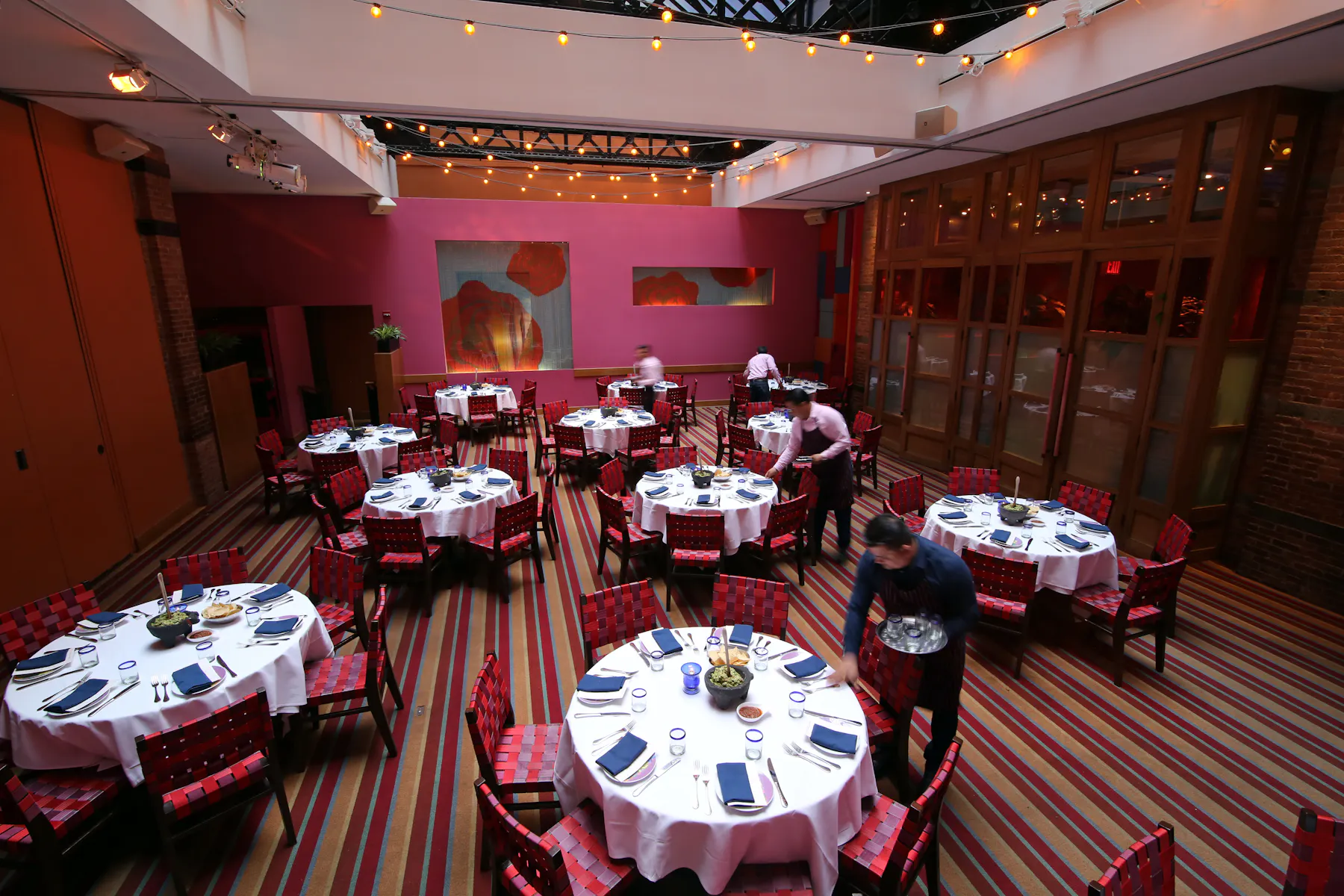 round tables being prepared for diners