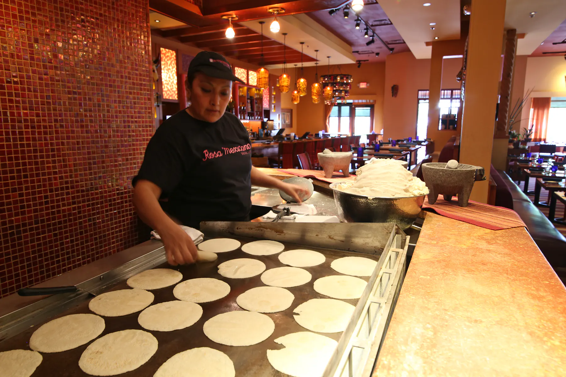 handmade tortiallas being made on a grill