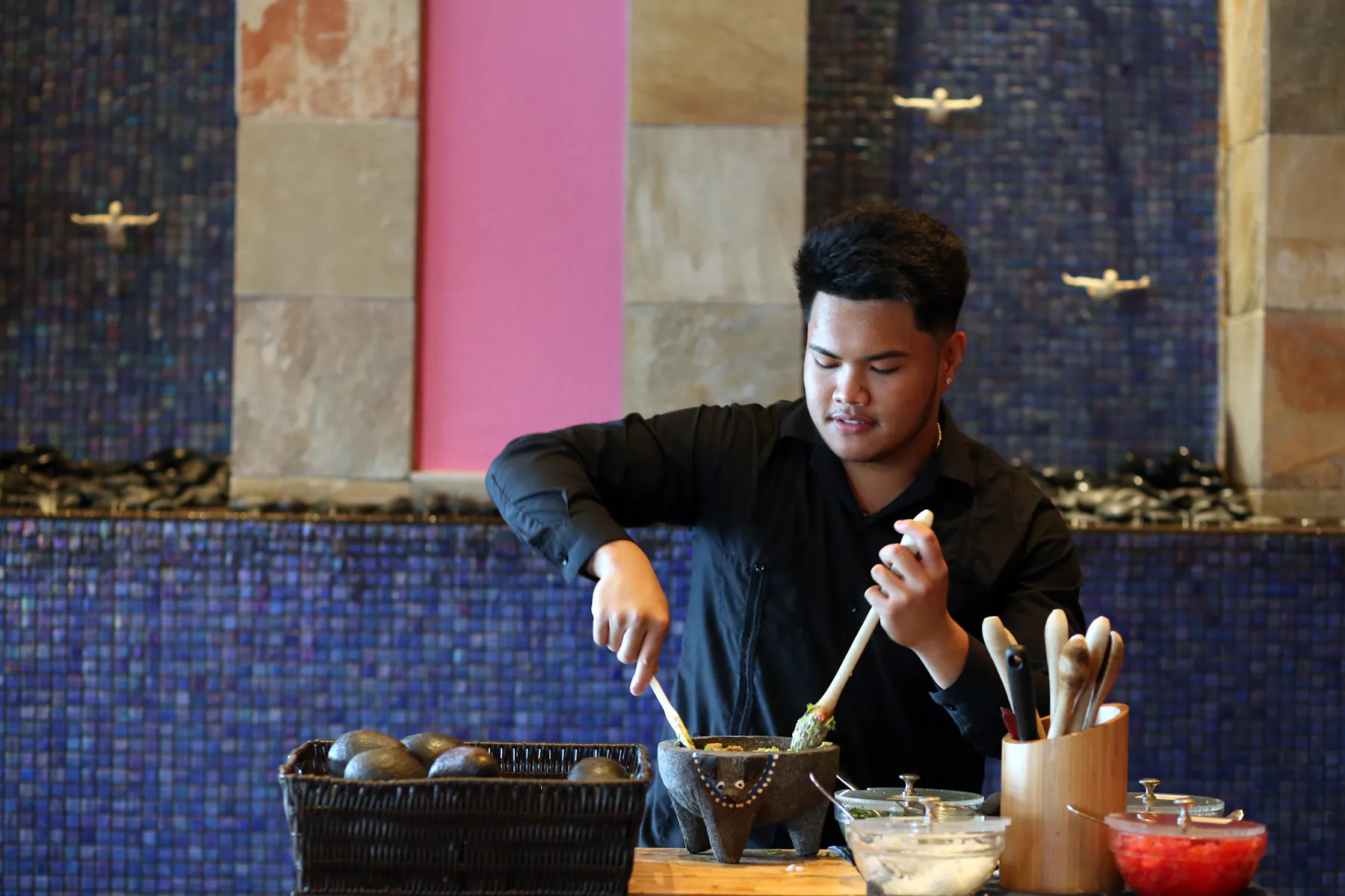 chef making guacomole