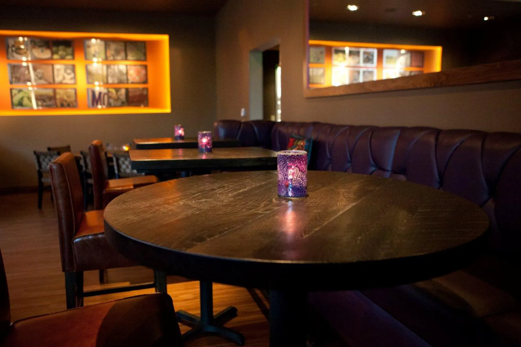 purple lanterns on top of round farm tables