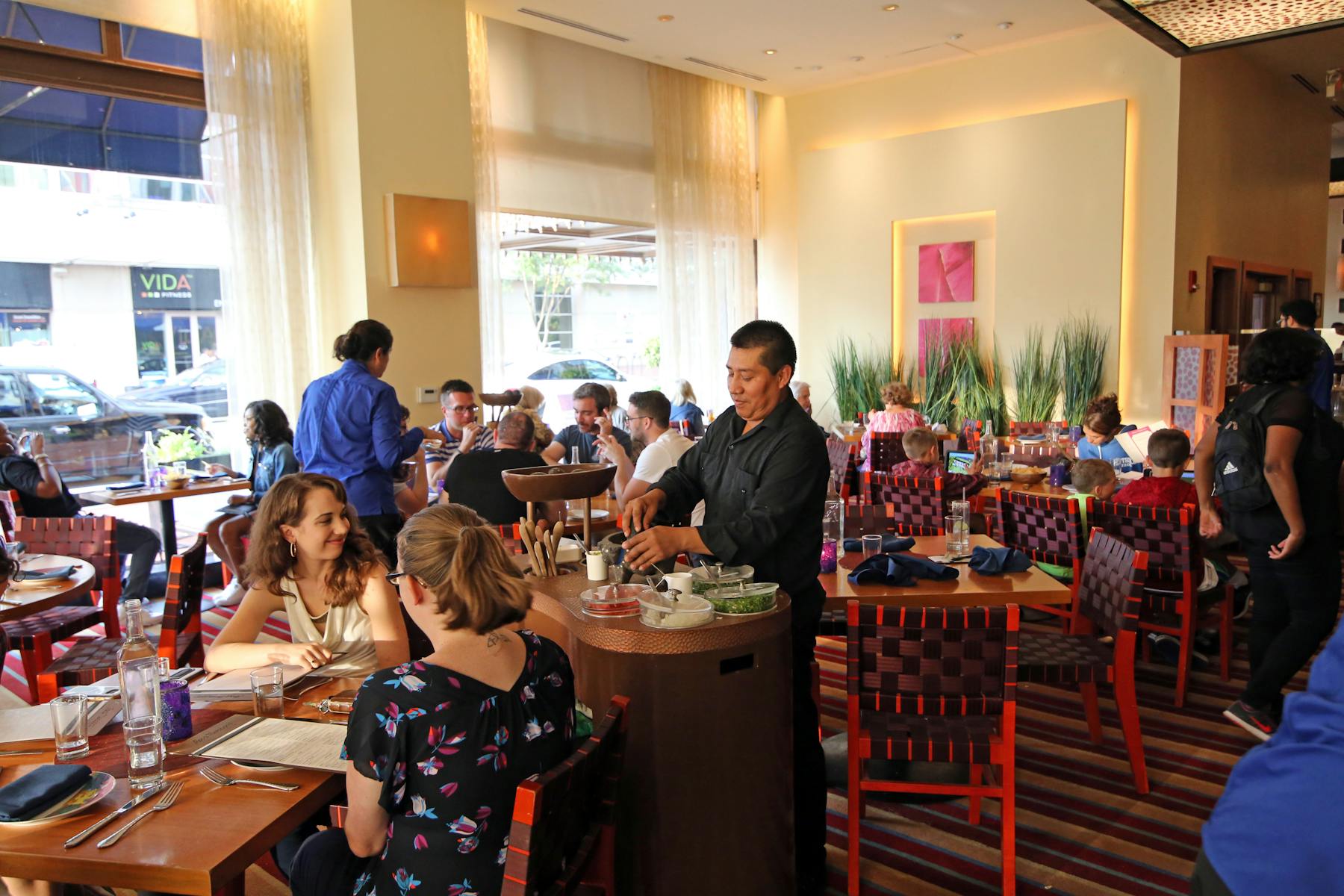 waiter serving diners at Rosa Mexicano in Washington D.C.