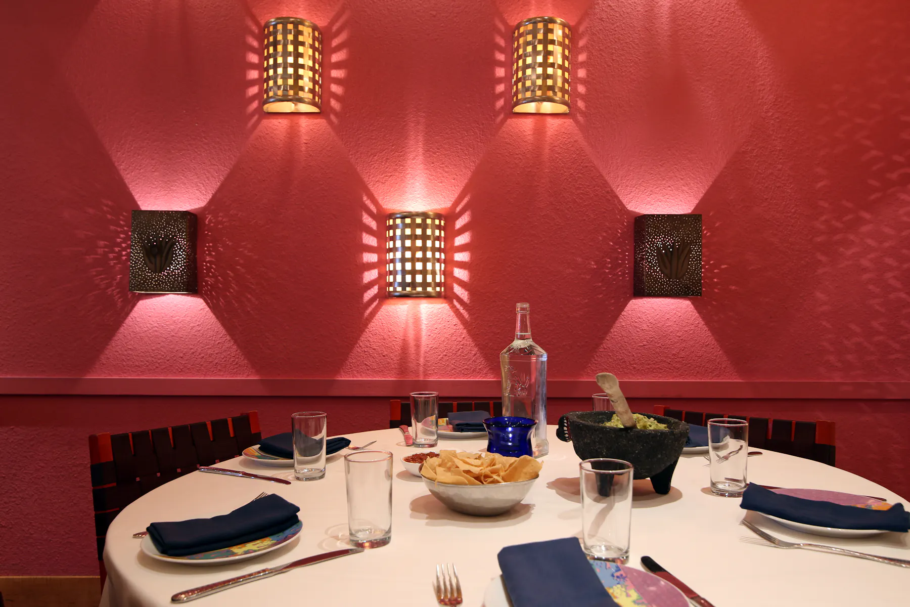 guacamole and chips being served at a round table