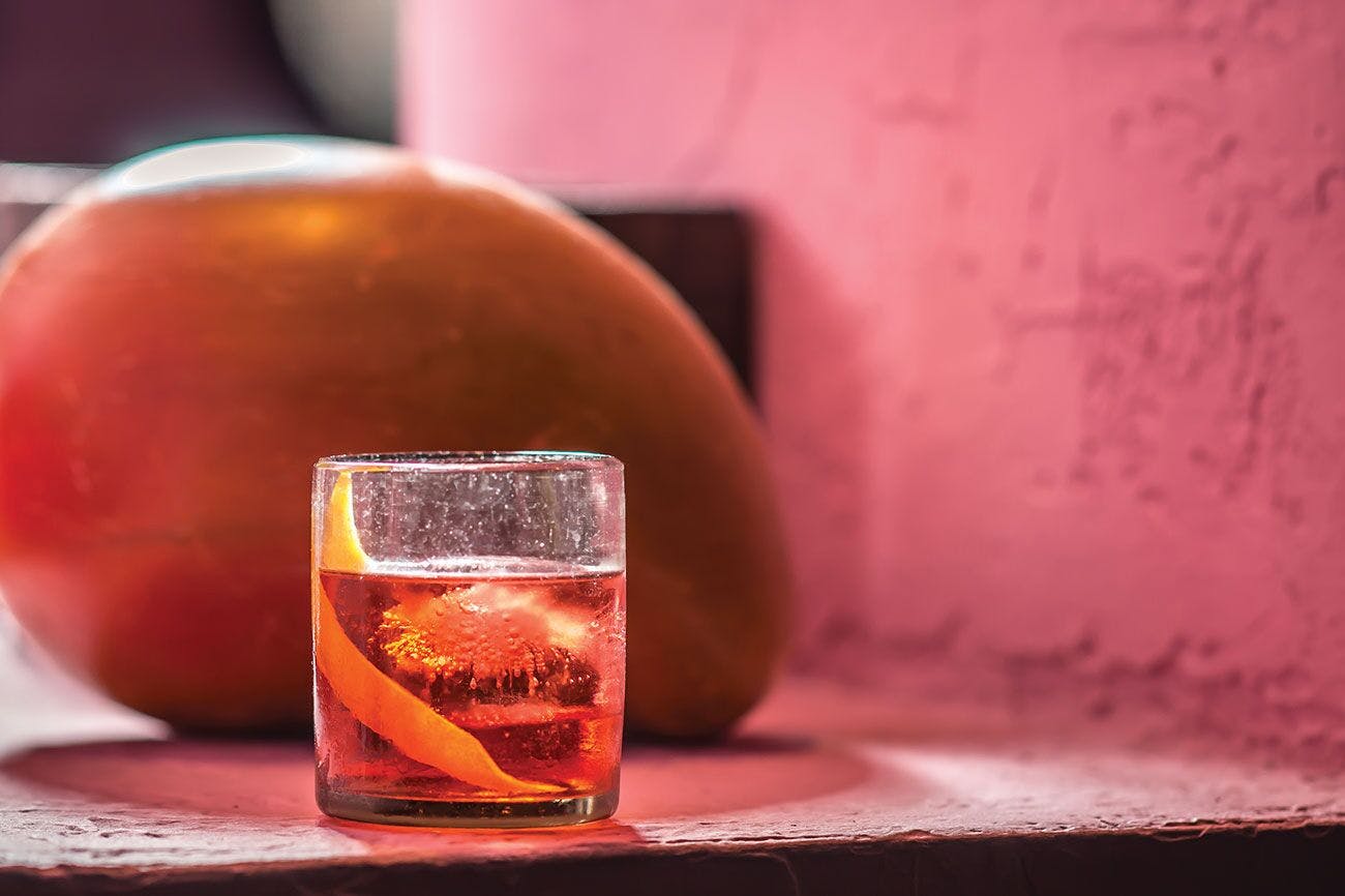 a cocktail served in a glass