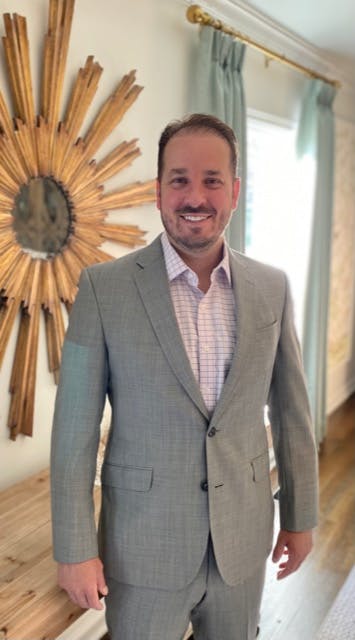 a person standing posing for the camera