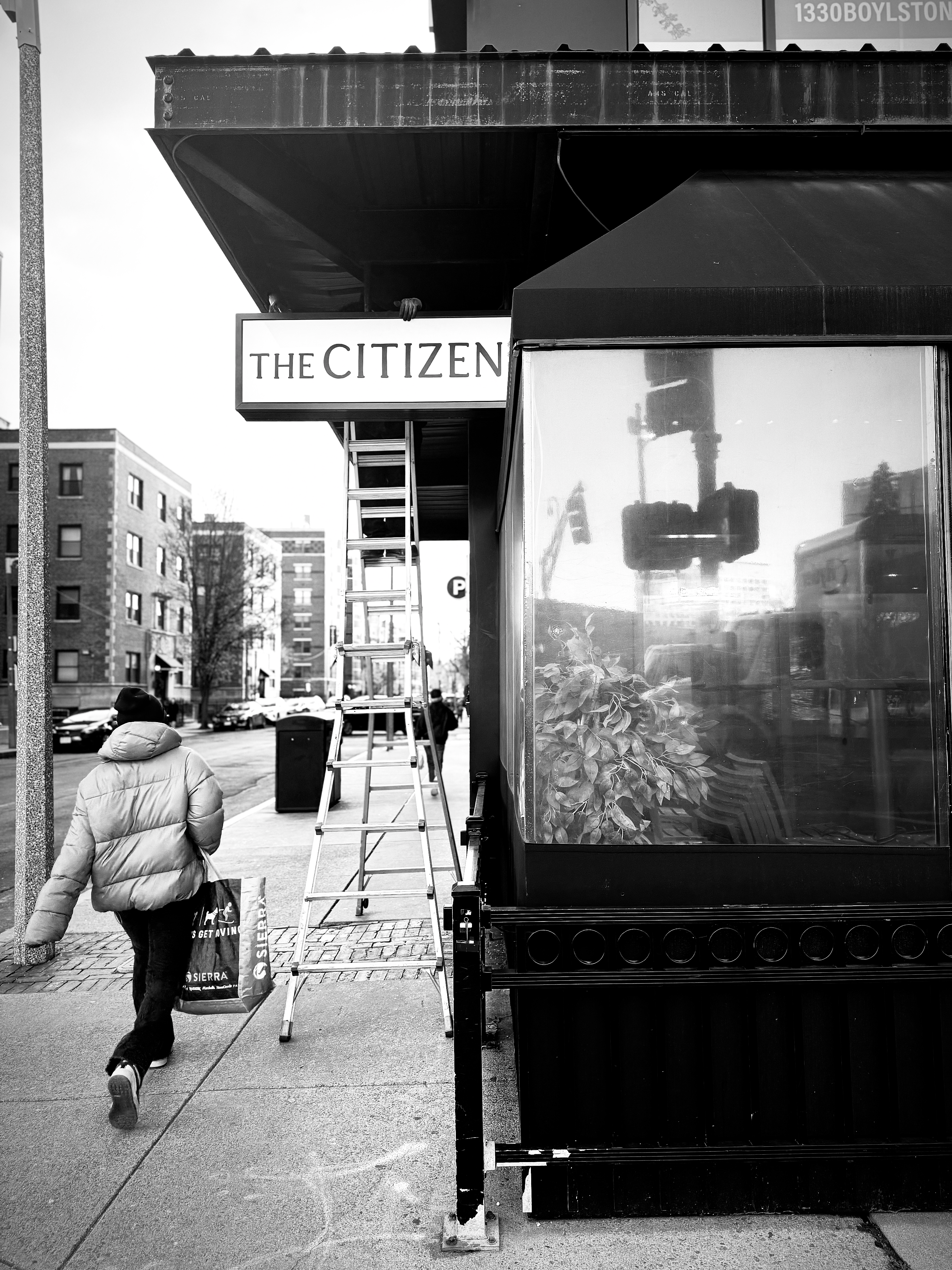 a person standing in front of a store