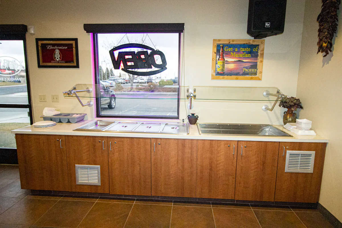 a desk with a laptop in a room