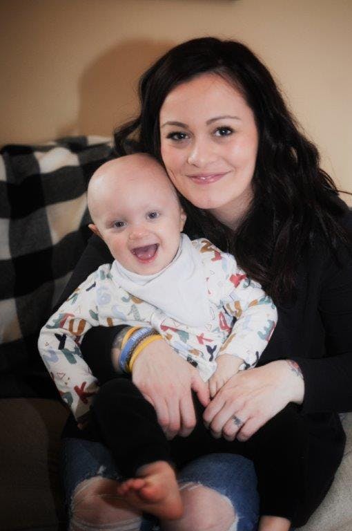 a person holding a baby
