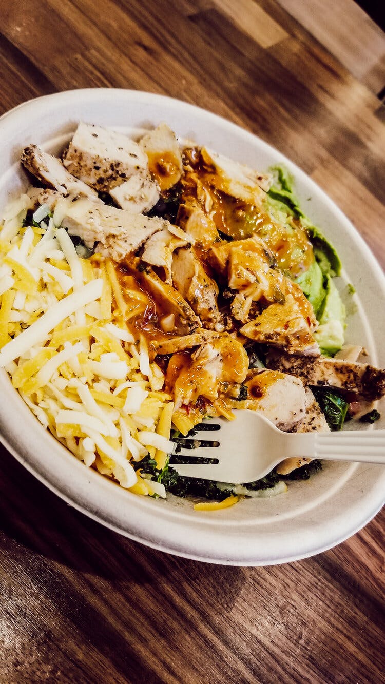 a plate of food on a wooden table