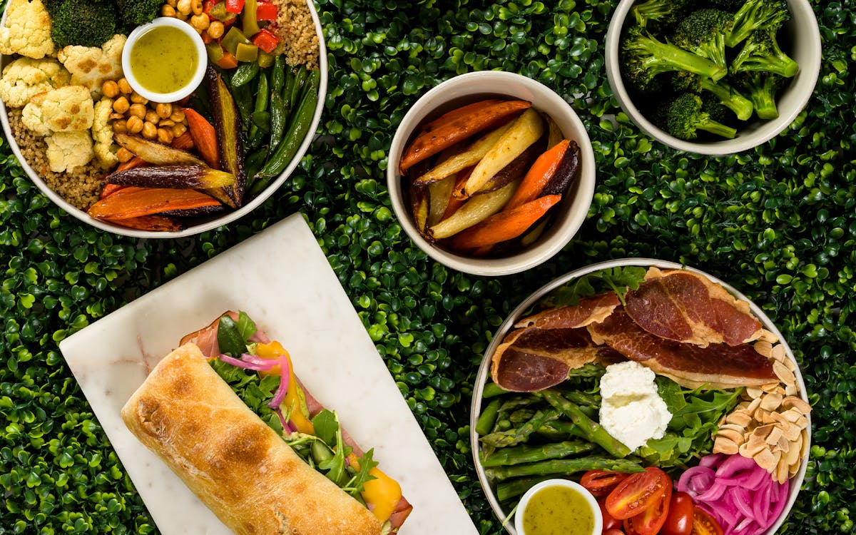 a box filled with different types of food on a plate