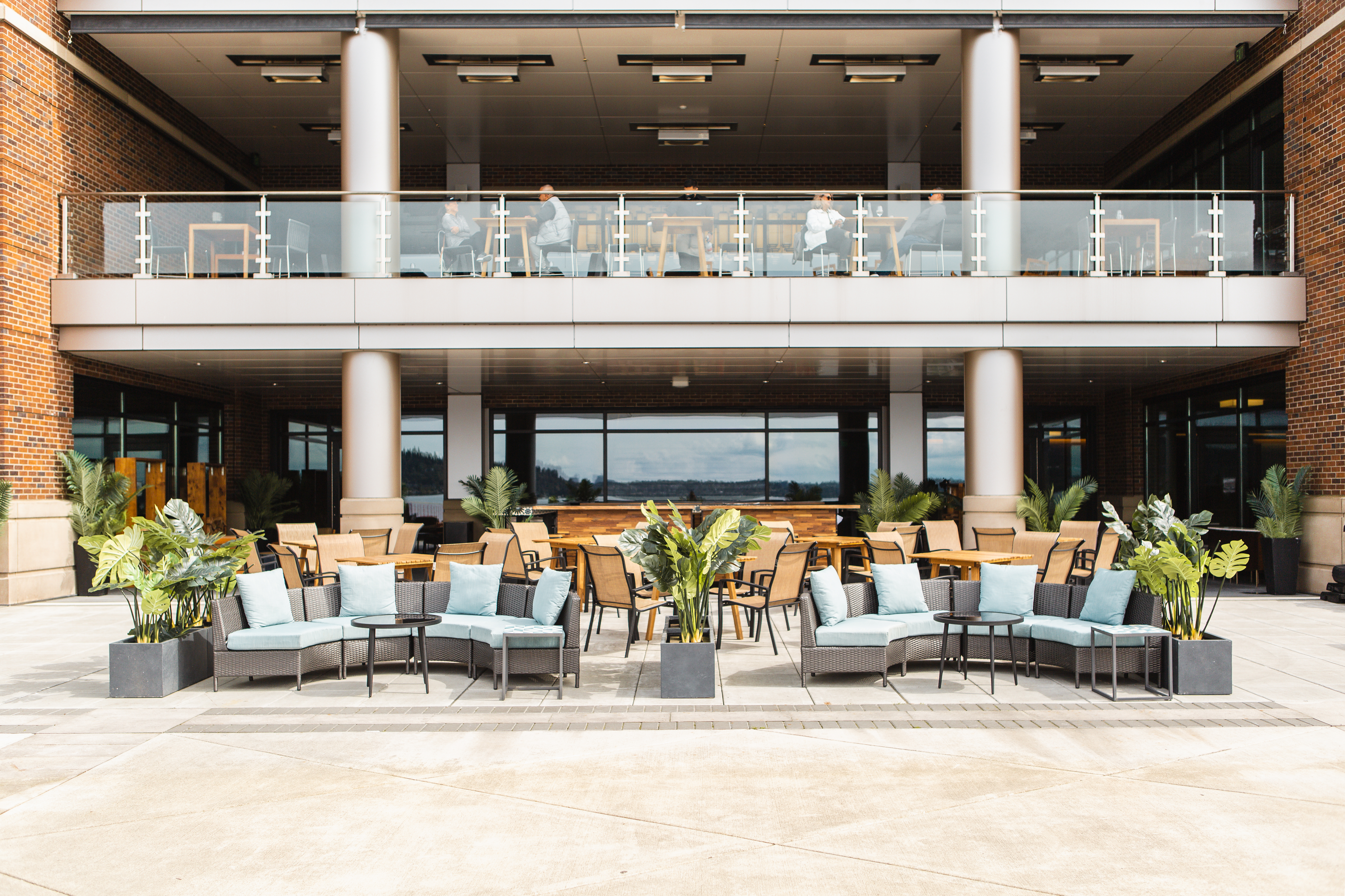a group of people sitting at a table in front of a building