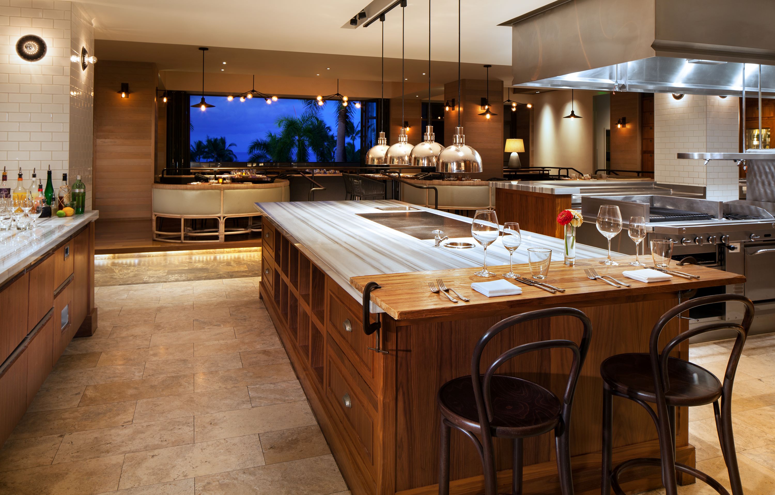 a kitchen with an island in the middle of a room