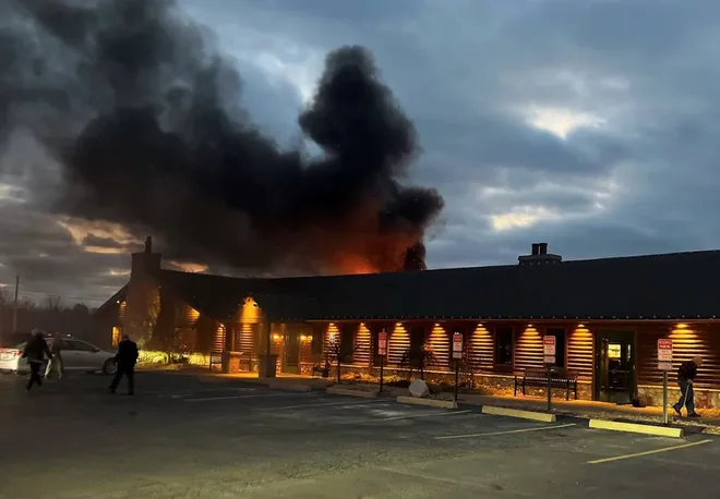 a train on a track with smoke coming out of it