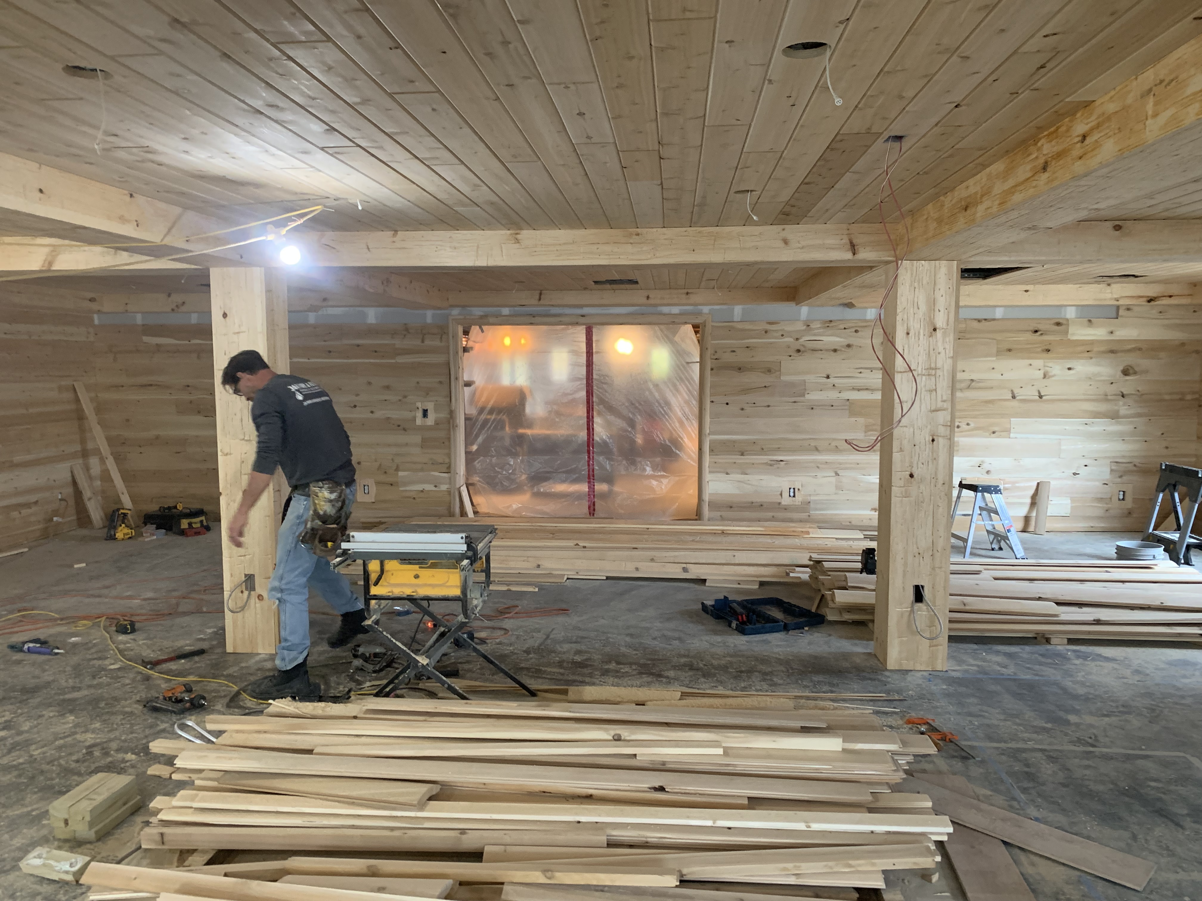a man standing on top of a wooden floor