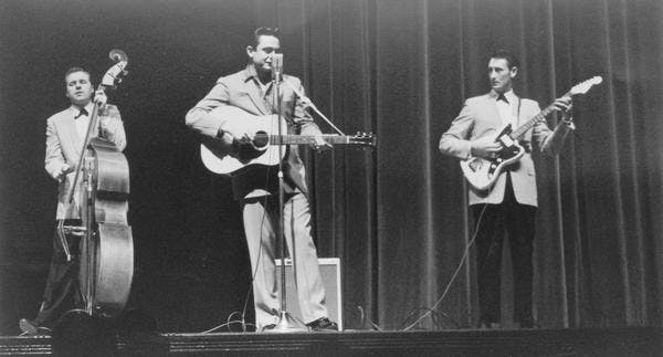 johnny cash standing on a stage