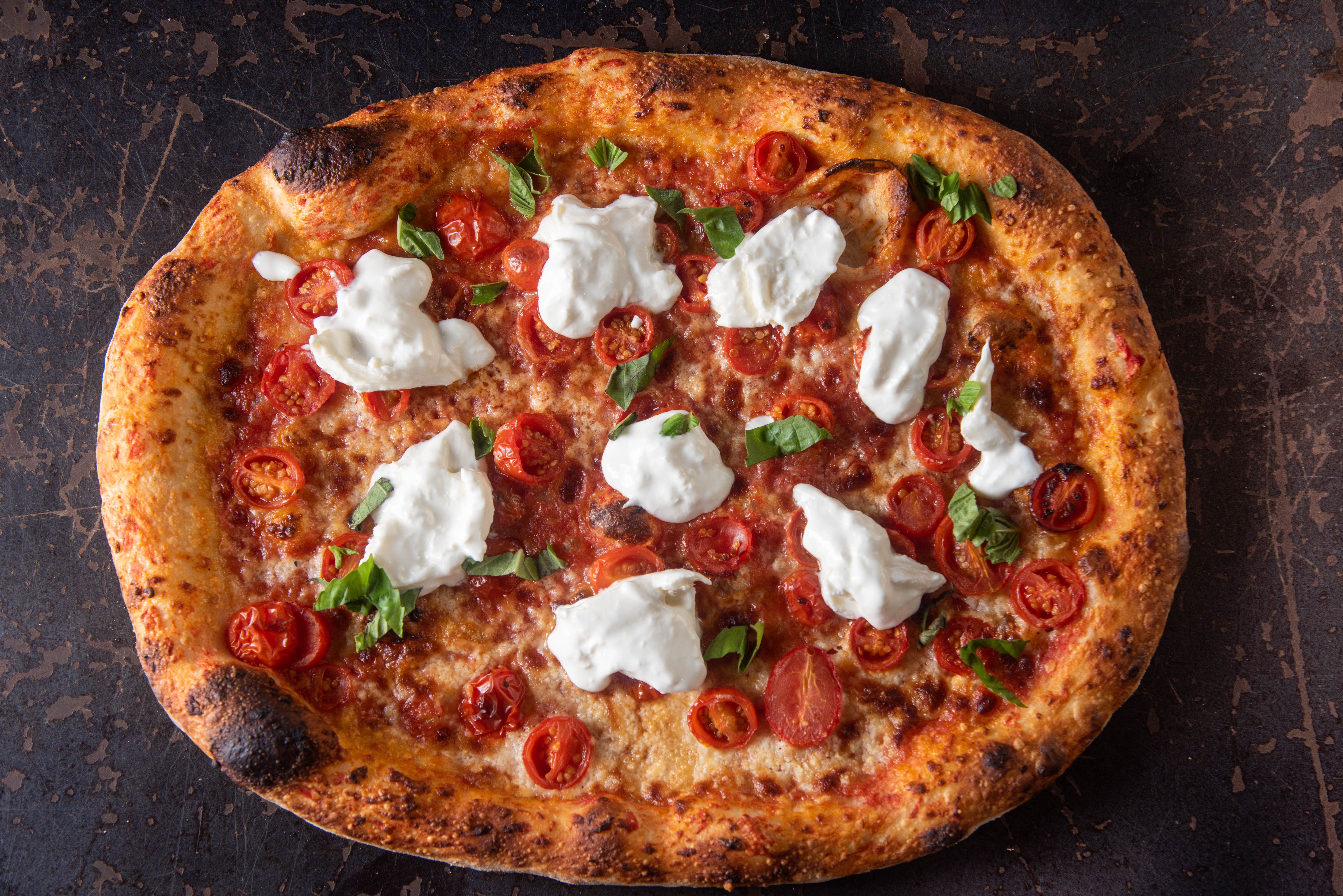 a pizza sitting on top of a pan
